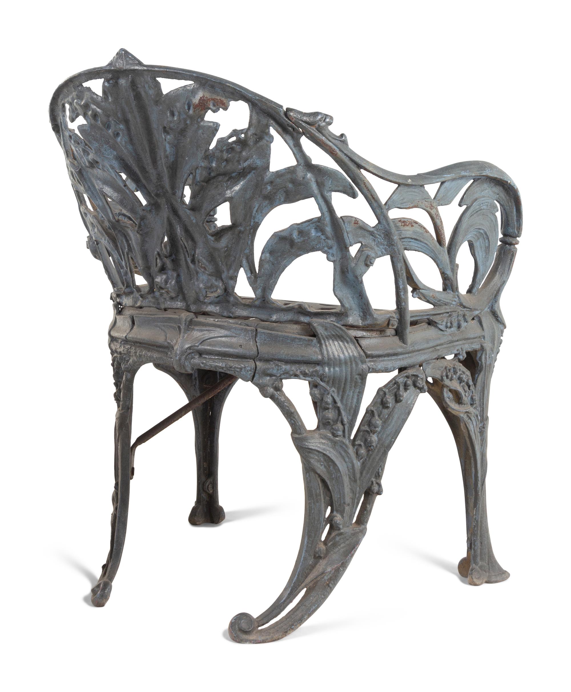 A Set of Four English Cast Iron Garden Chairs
