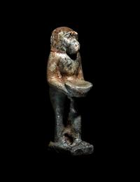 An Egyptian Faience Baboon Holding a Tray