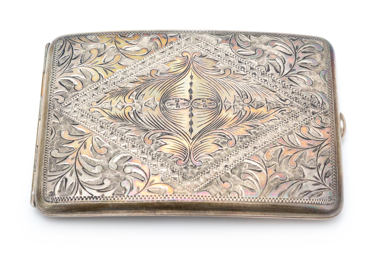 An American Silver Cigarette Case, , the case worked with foliate and geometric motifs throughout.