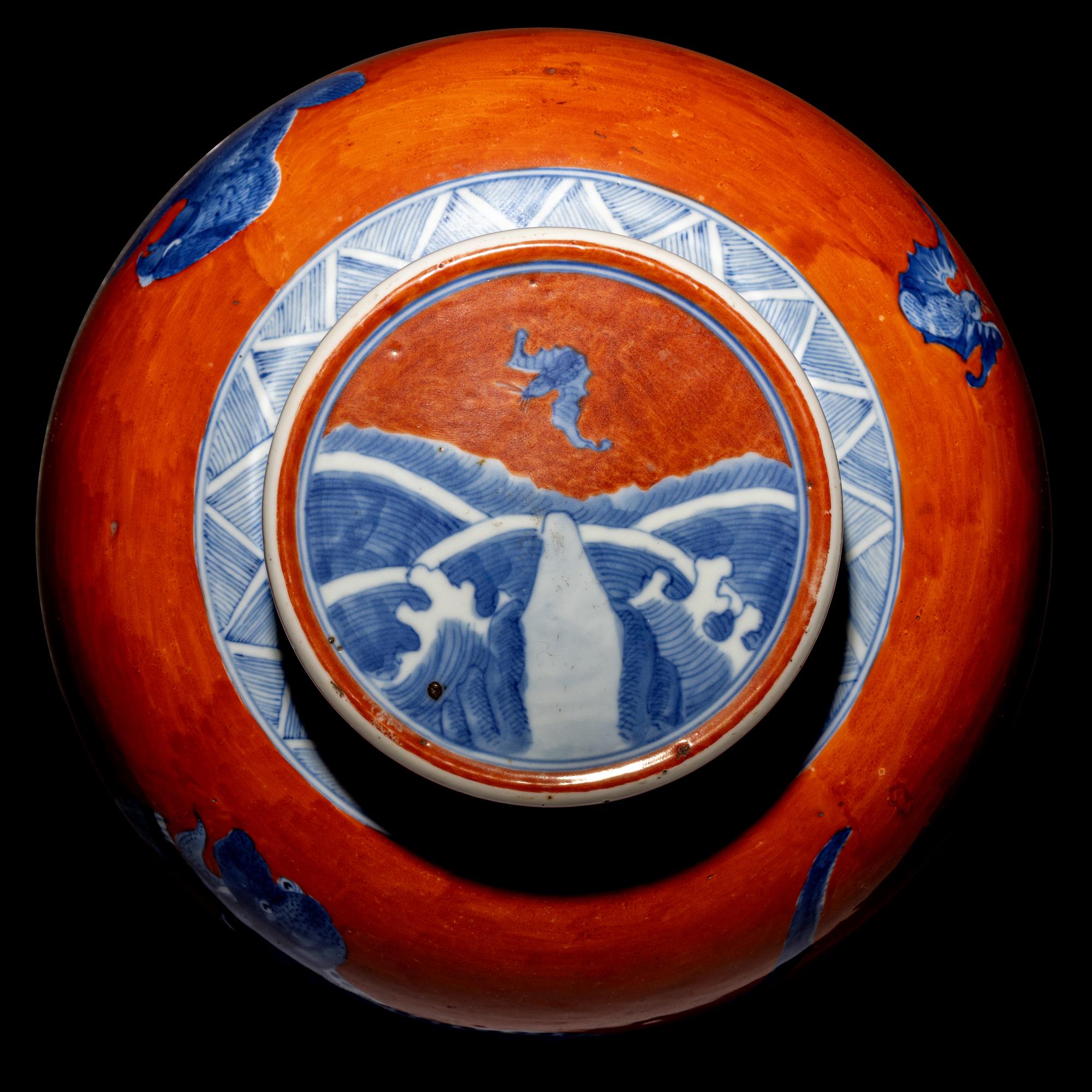 A Chinese Coral-Red Ground Underglaze Blue Porcelain Covered Ginger Jar, 18th Century 清中期 珊瑚紅地青花瑞獸圖蓋罐