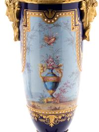A Pair of Sèvres Style Gilt Bronze Mounted Painted, Parcel Gilt and "Jeweled" Porcelain Urns