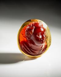 A Roman Carnelian Cameo of a Boy — Set in a gold pendant