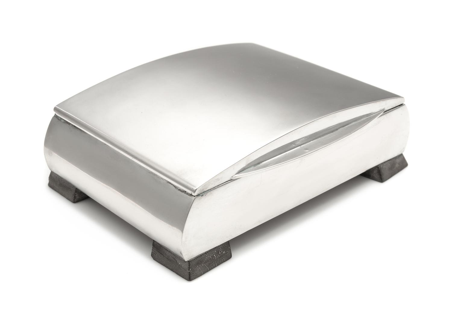 A Hungarian Silver Table Top Cigarette Case, Maker's Mark TL, Second Quarter 20th Century, the bowed lid above the conforming case, rai