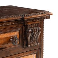 An Italian Carved Walnut Chest of Drawers