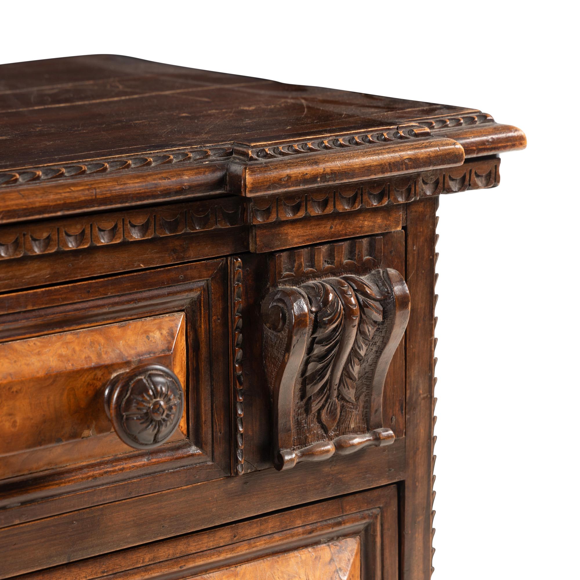 An Italian Carved Walnut Chest of Drawers