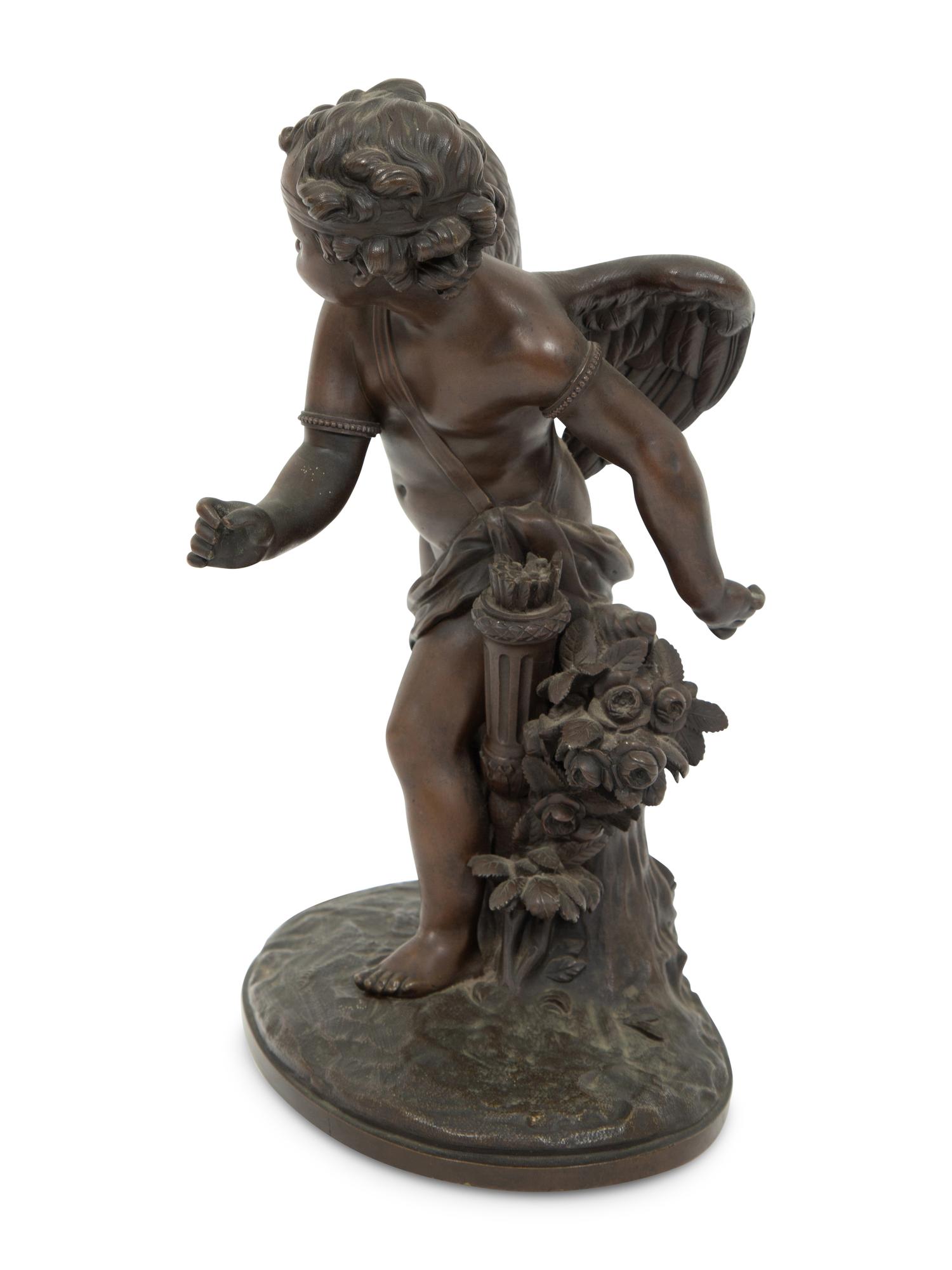 A French Bronze Figure of Eros on a Wood Base