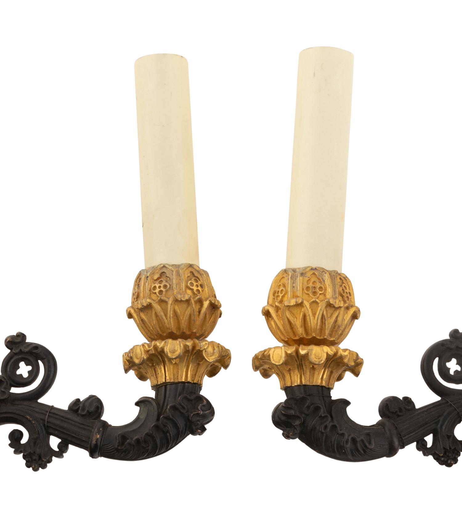 A Pair of Charles X Gilt and Patinated Bronze Four-Light Sconces