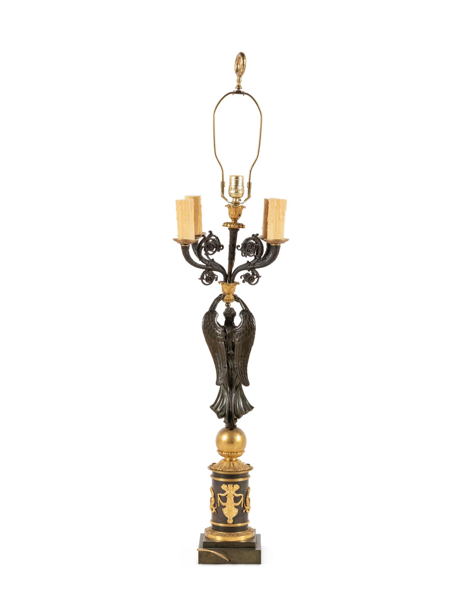 An Empire Style Gilt and Patinated Bronze Figural Five-Light Candelabrum