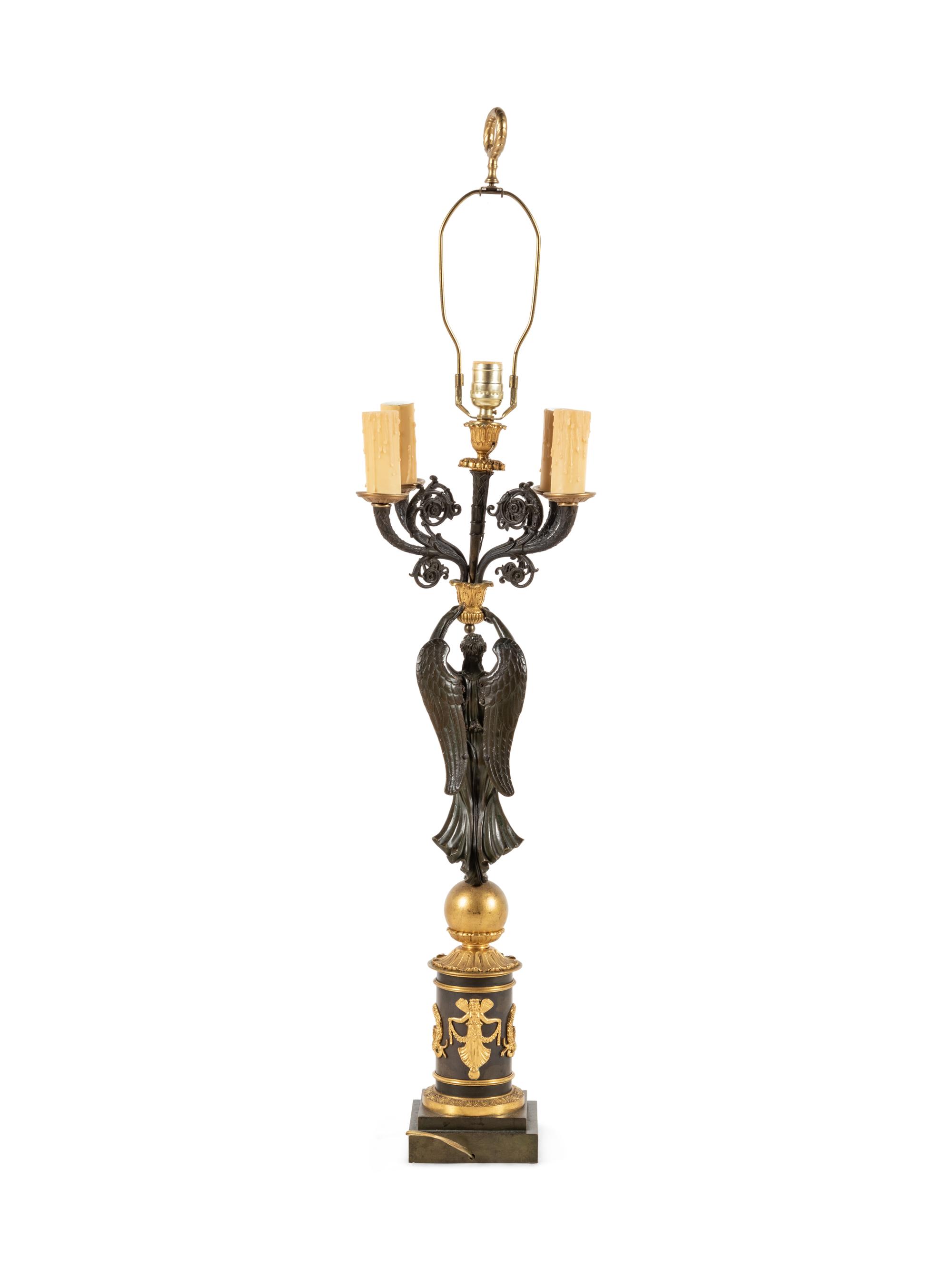 An Empire Style Gilt and Patinated Bronze Figural Five-Light Candelabrum