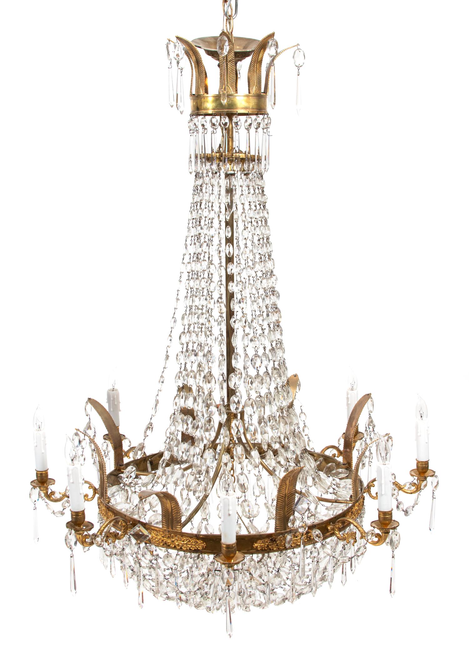 A Regency Style Gilt Metal and Glass Swag Tiered Chandelier Height 48 x diameter 32 inches. — 19TH CENTURY