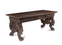 A Renaissance Revival Carved Walnut Trestle Table