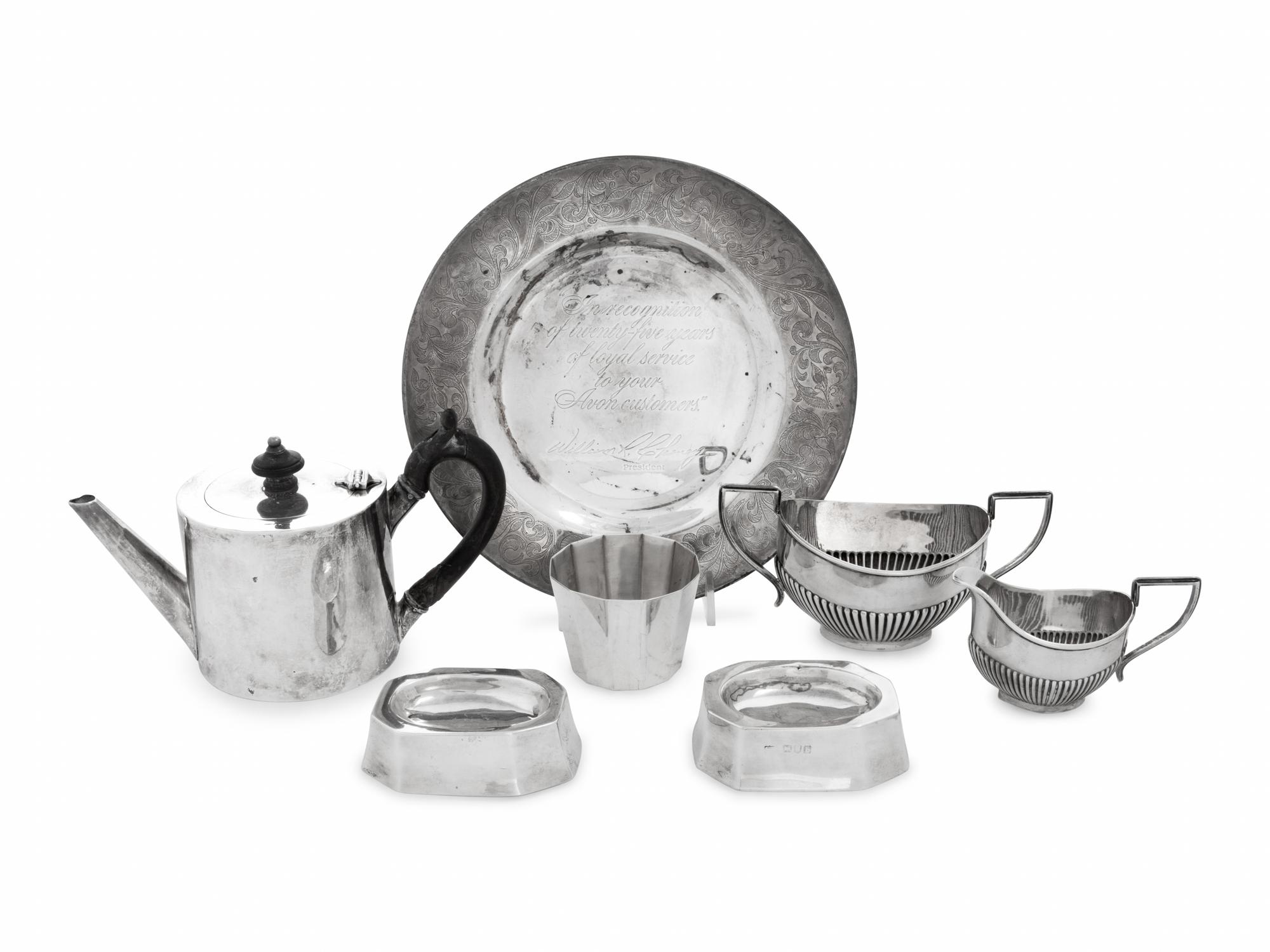 A Collection of Eight English Silver Table Articles