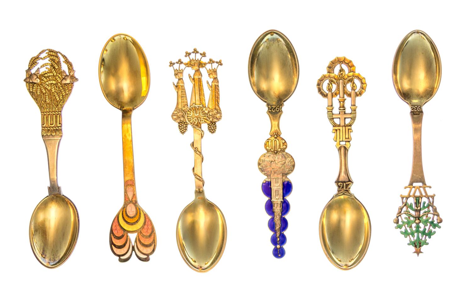 A Collection of Danish Silver-Gilt and Enamel Christmas Spoons, Anton Michelsen, Copenhagen, comprising examples from the years 1912, 1