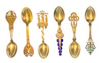 A Collection of Danish Silver-Gilt and Enamel Christmas Spoons, Anton Michelsen, Copenhagen, comprising examples from the years 1912, 1