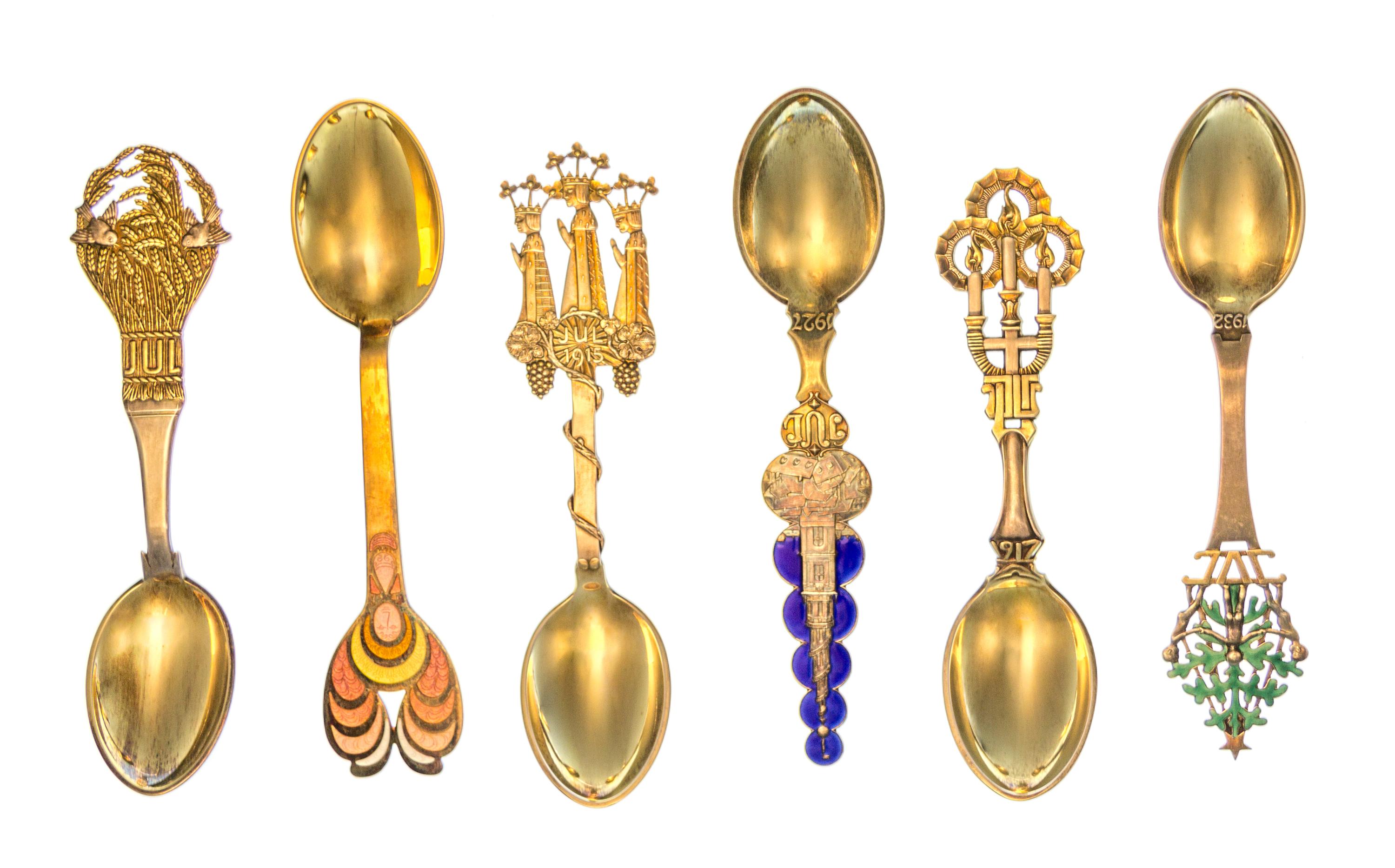 A Collection of Danish Silver-Gilt and Enamel Christmas Spoons, Anton Michelsen, Copenhagen, comprising examples from the years 1912, 1