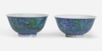 An associated pair of Chinese underglaze blue and green-enameled dragon bowls 珐琅彩青花龙纹碗一对 Kangxi six-character mark and of the period ????? ???