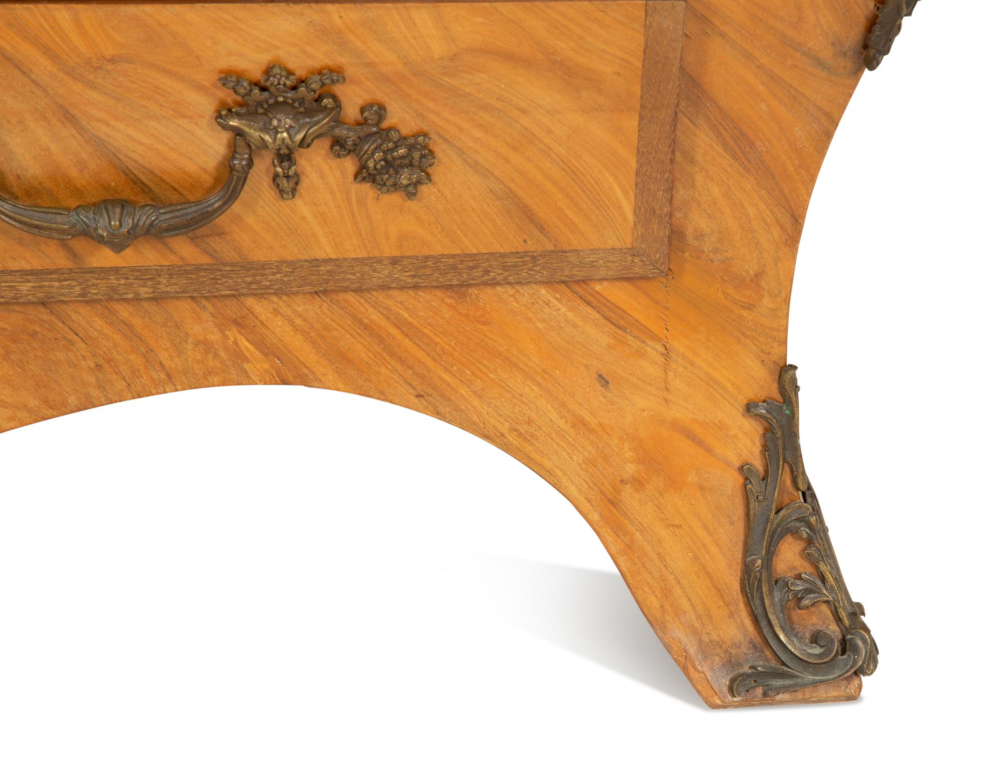 A Louis XV Style Gilt Bronze Mounted Marble-Top Bombe Commode
