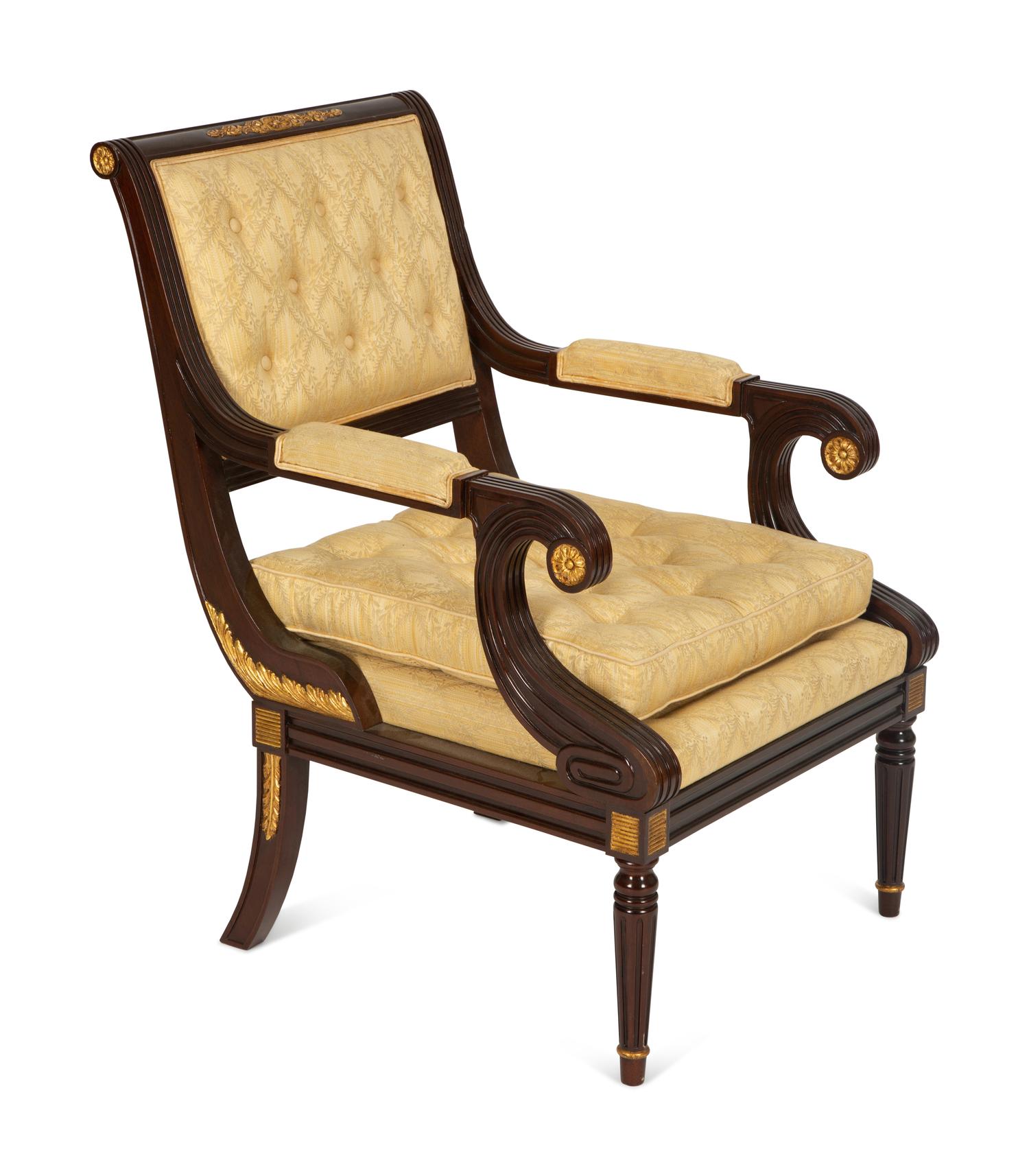 A French Empire Style Mahogany and Parcel Gilt Fauteuil