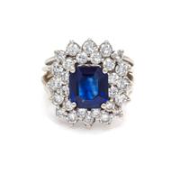 An 18 Karat White Gold, Sapphire and Diamond Ring, 5.30 dwts.