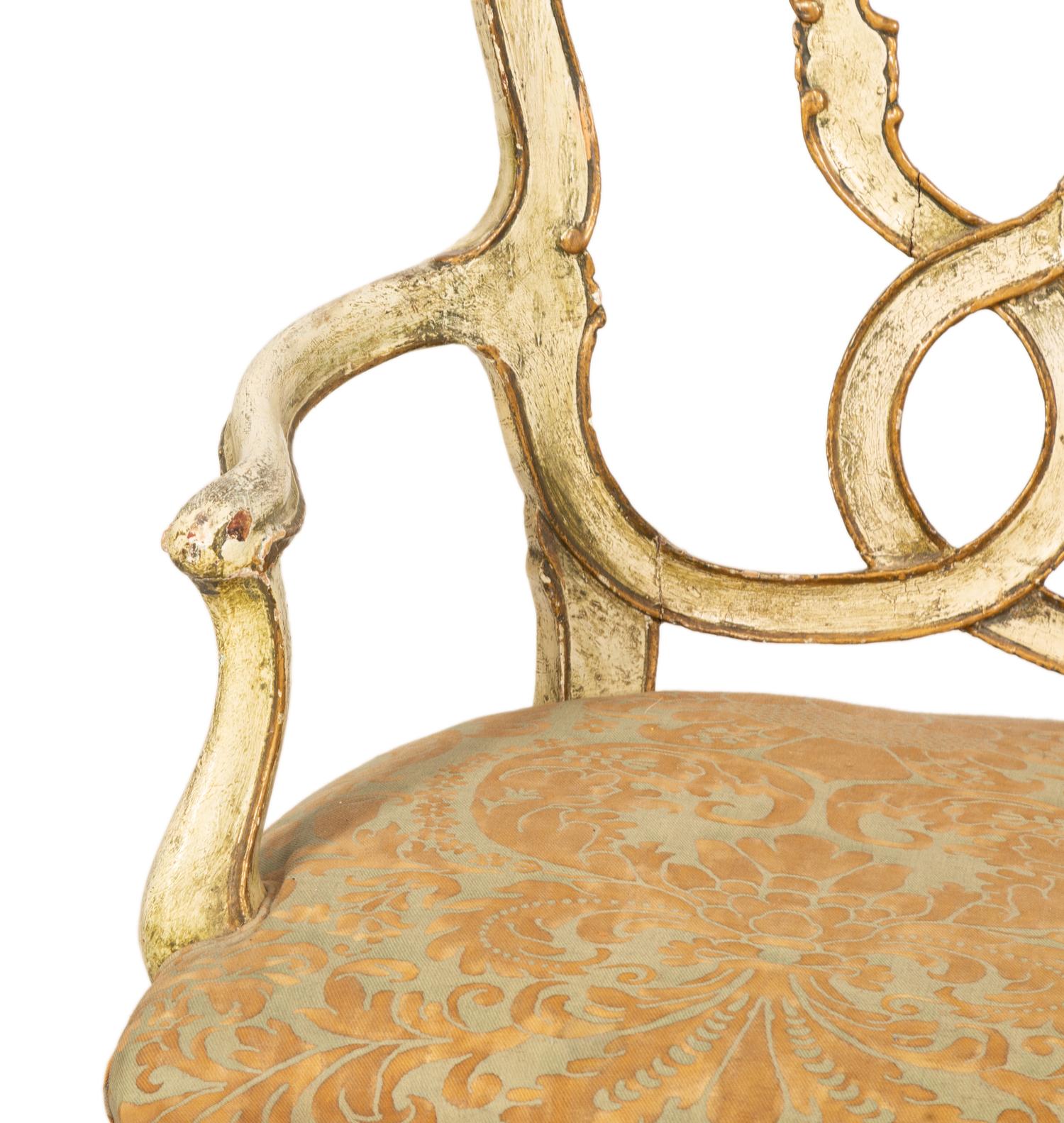 An Italian Painted and Parcel Gilt Settee with Fortuny Upholstery