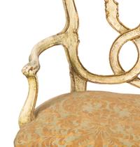 An Italian Painted and Parcel Gilt Settee with Fortuny Upholstery