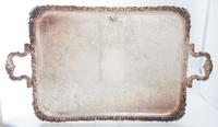 A Group of Silver-Plate Serving Trays Width of widest over handles 30 inches.