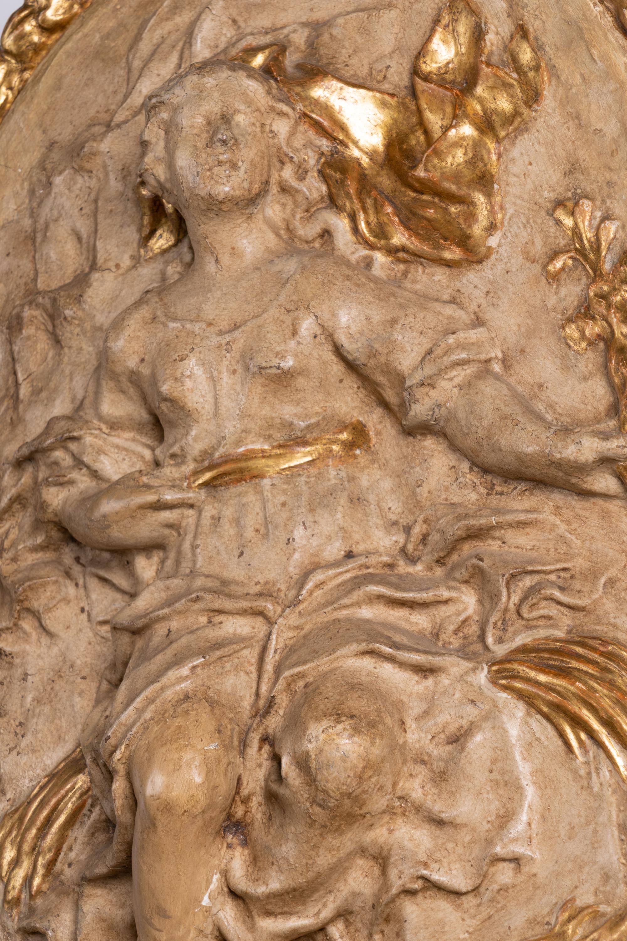 Four Italian Neoclassical Painted and Parcel-Gilt Papier-Mâché Relief Plaques