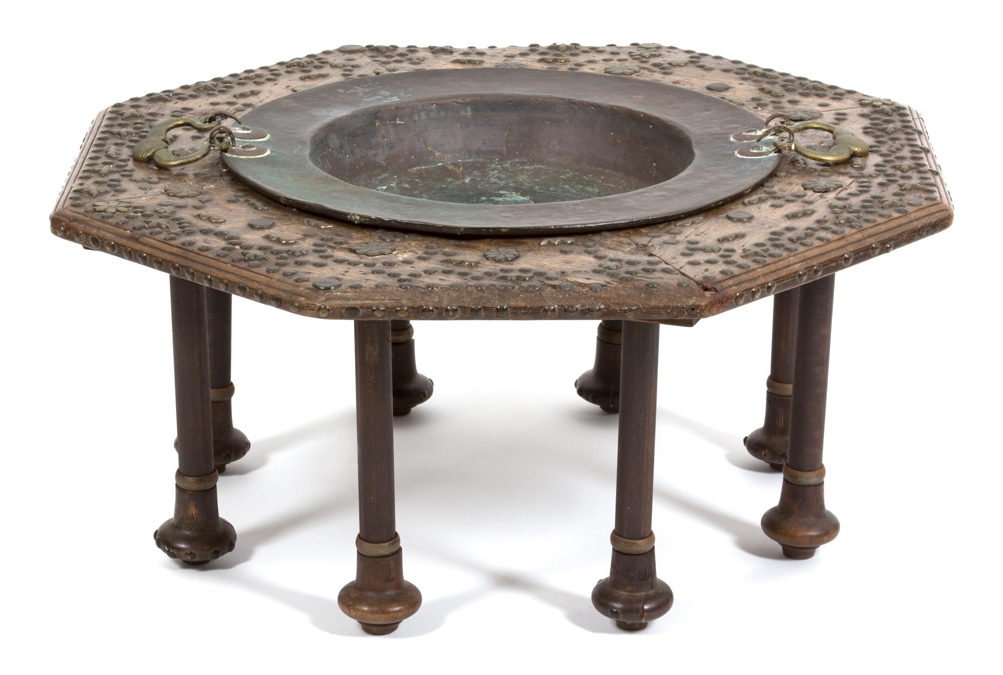 A Spanish Carved Walnut and Copper Inset Brazier Table Height 14 x diameter 33 inches. — POSSIBLY NORTHERN SPAIN, 18TH/19TH CENTURY