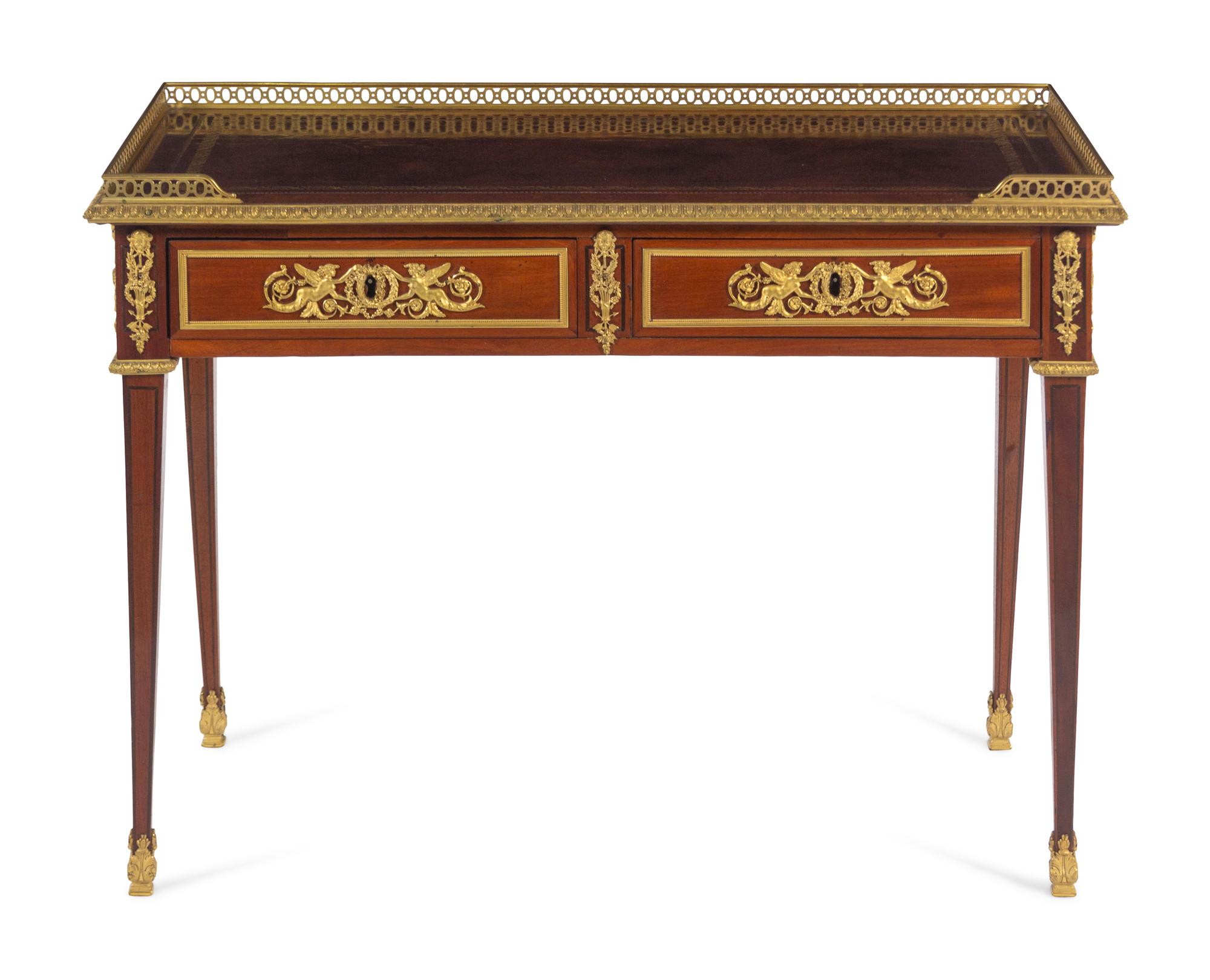A Louis XVI Style Gilt Bronze Mounted Mahogany Table à Écrire
