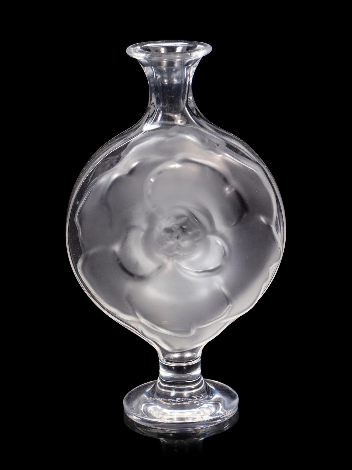 A Lalique Perfume Bottle and Three Lalique Fish