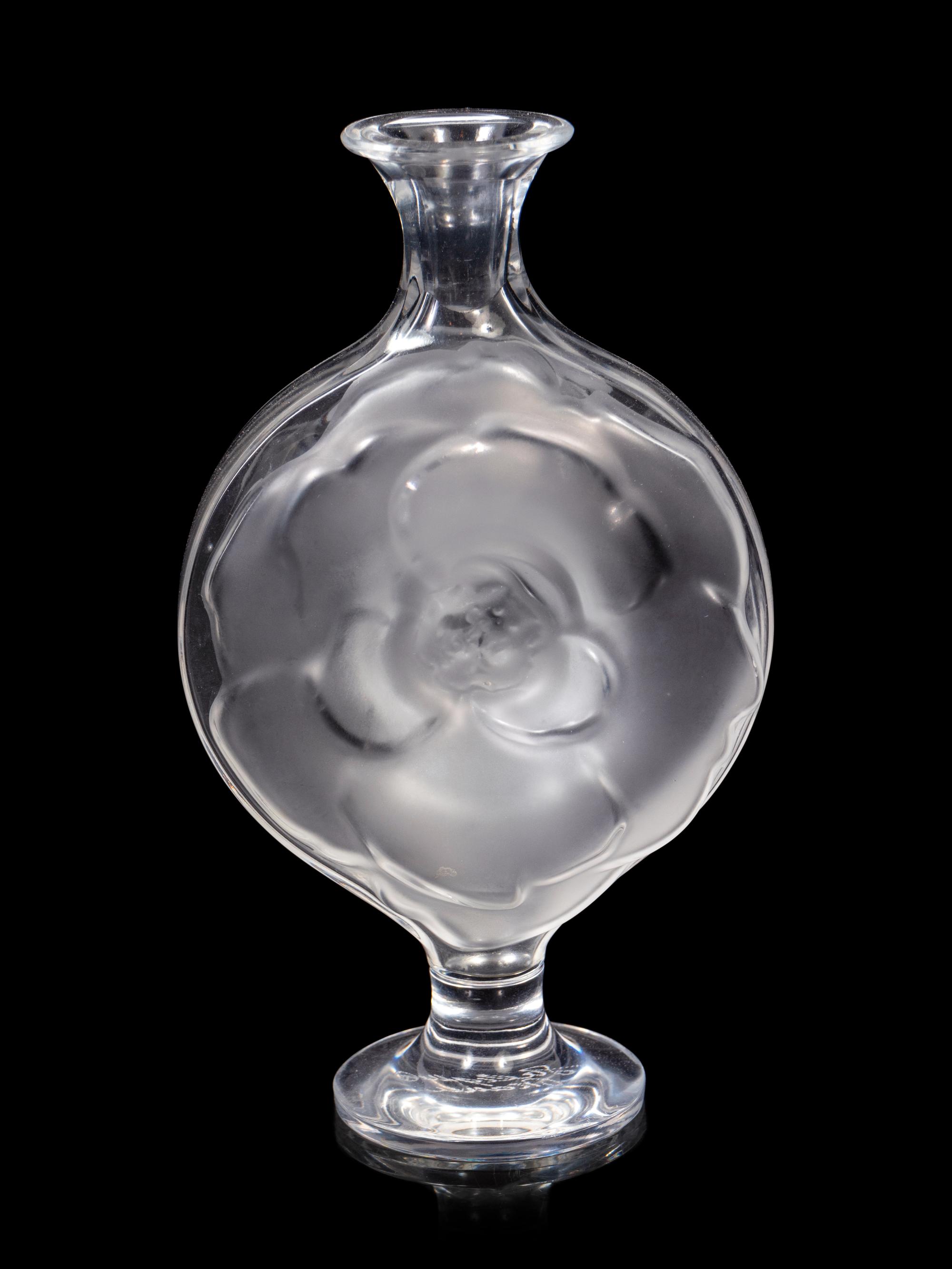 A Lalique Perfume Bottle and Three Lalique Fish