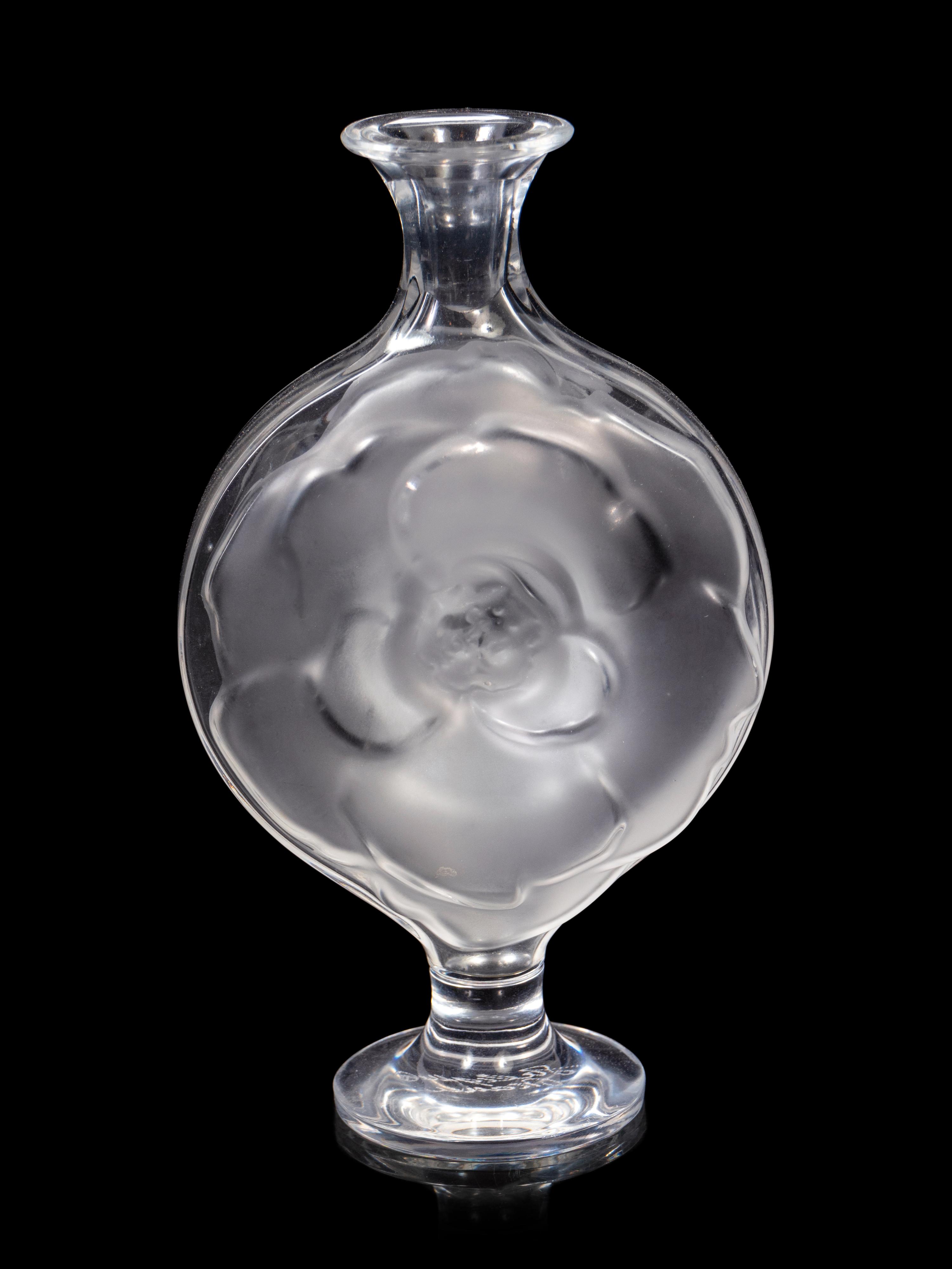 A Lalique Perfume Bottle and Three Lalique Fish