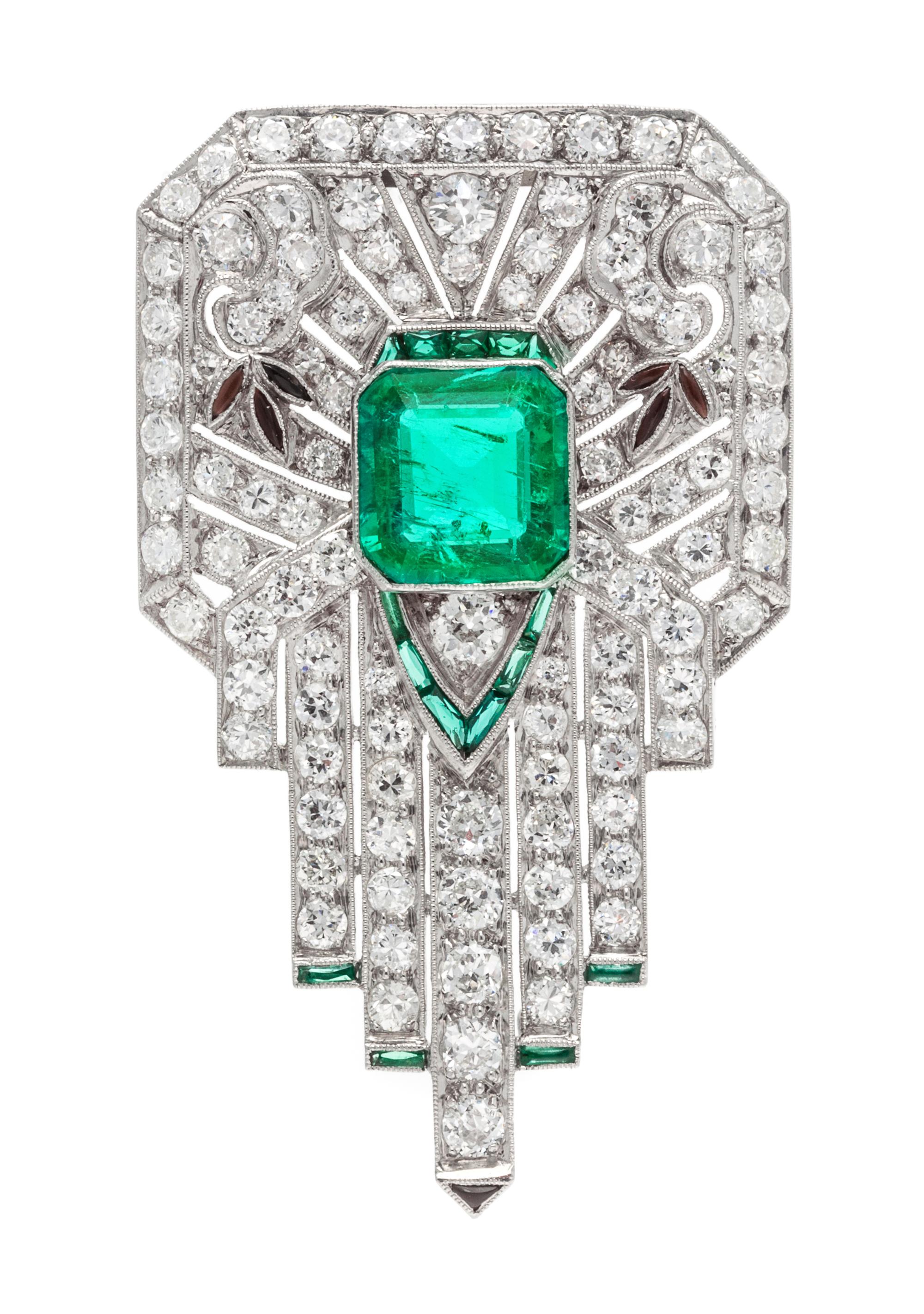 An Art Deco Platinum, Emerald, Diamond, and Multigem Clip Brooch, 8.90 dwts.