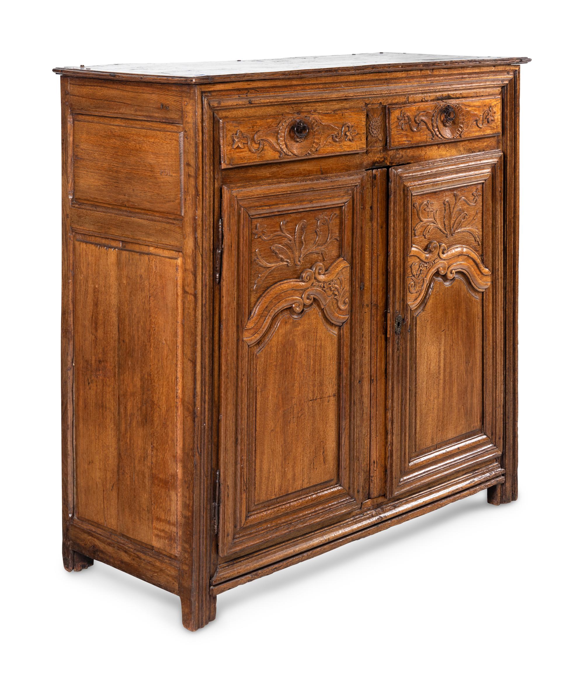 A French Provincial Carved Oak Cabinet