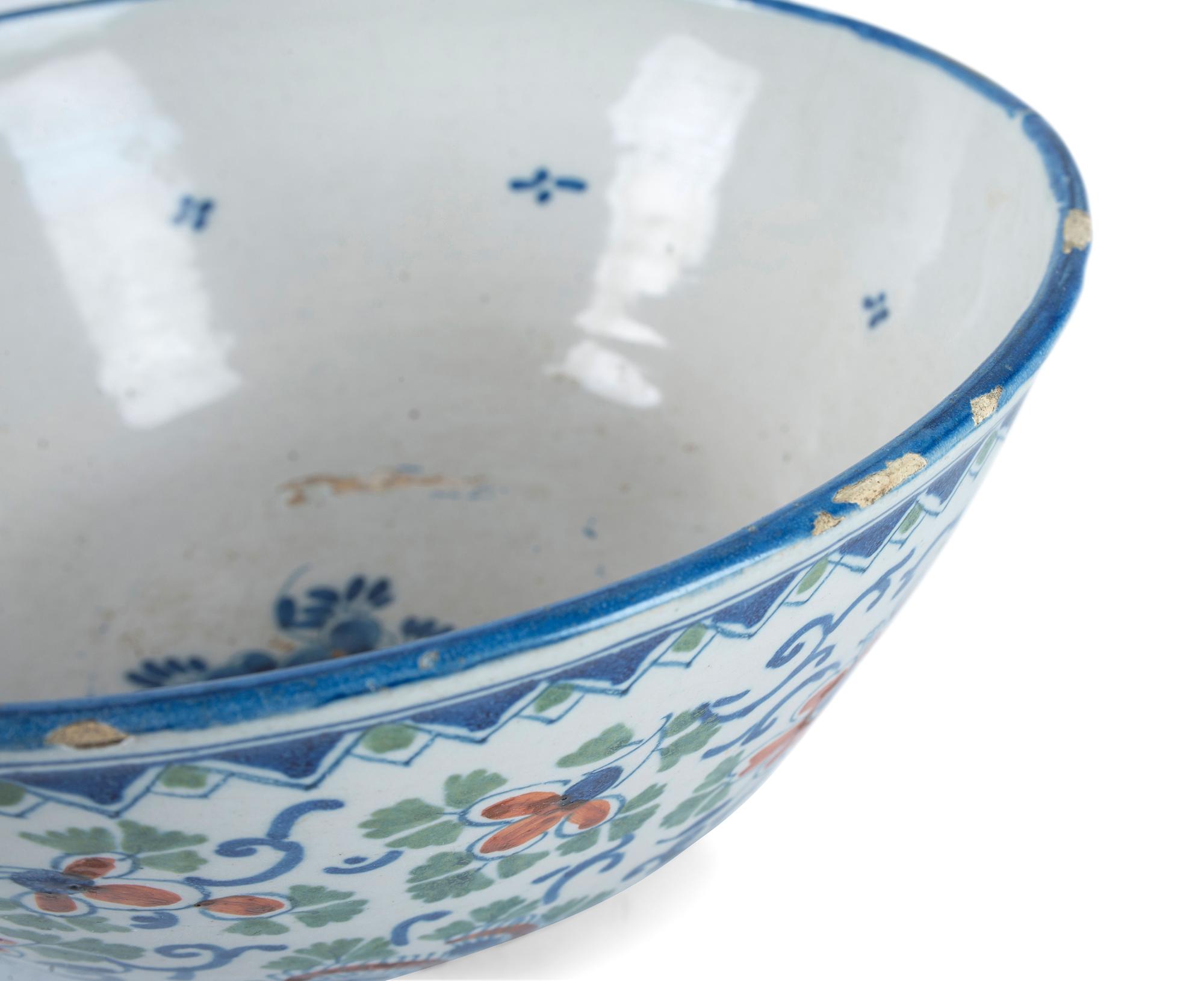 A Dutch Delft Polychrome Glazed Earthenware Punch Bowl
