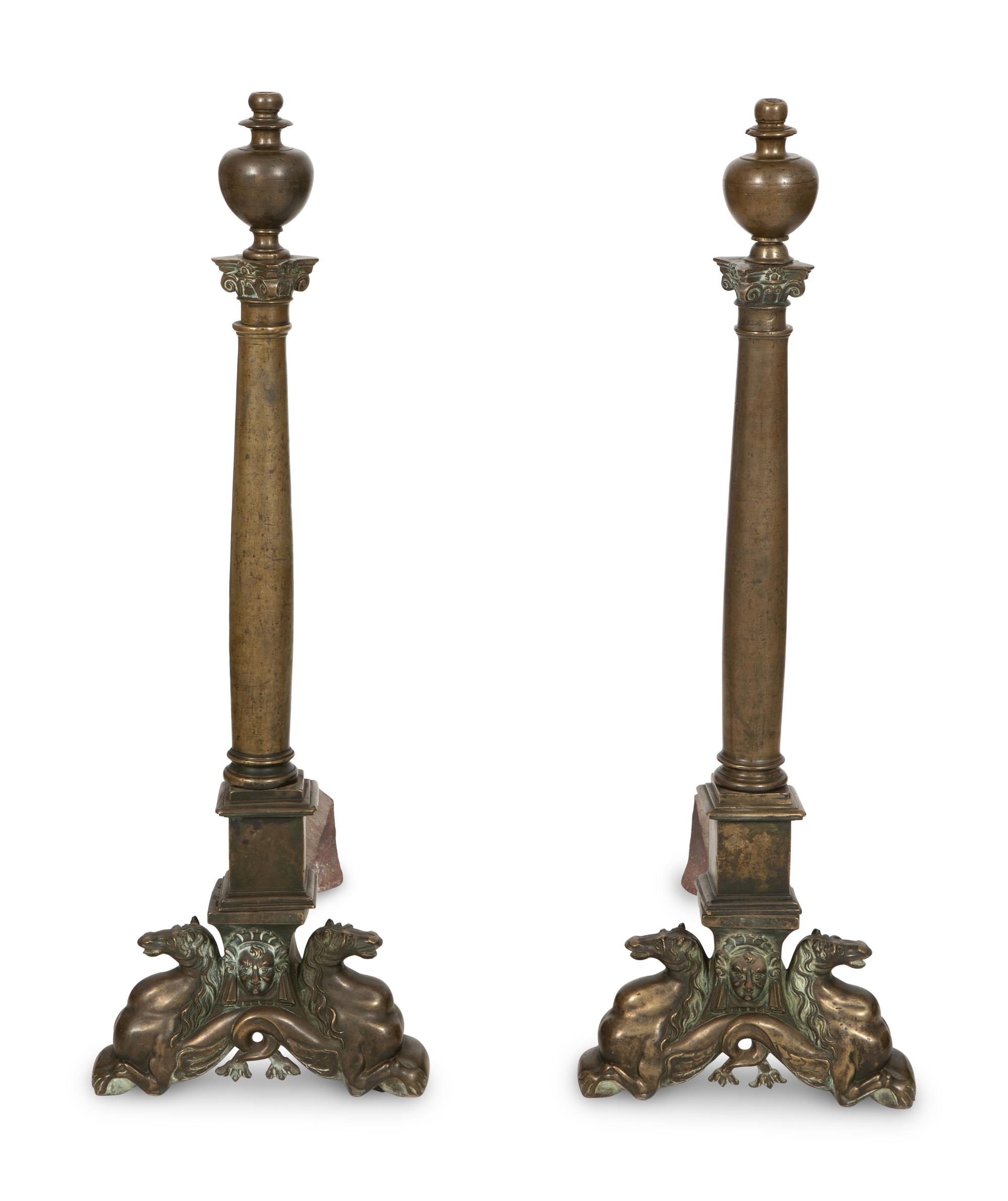 A Pair of Large Patinated Metal Andirons