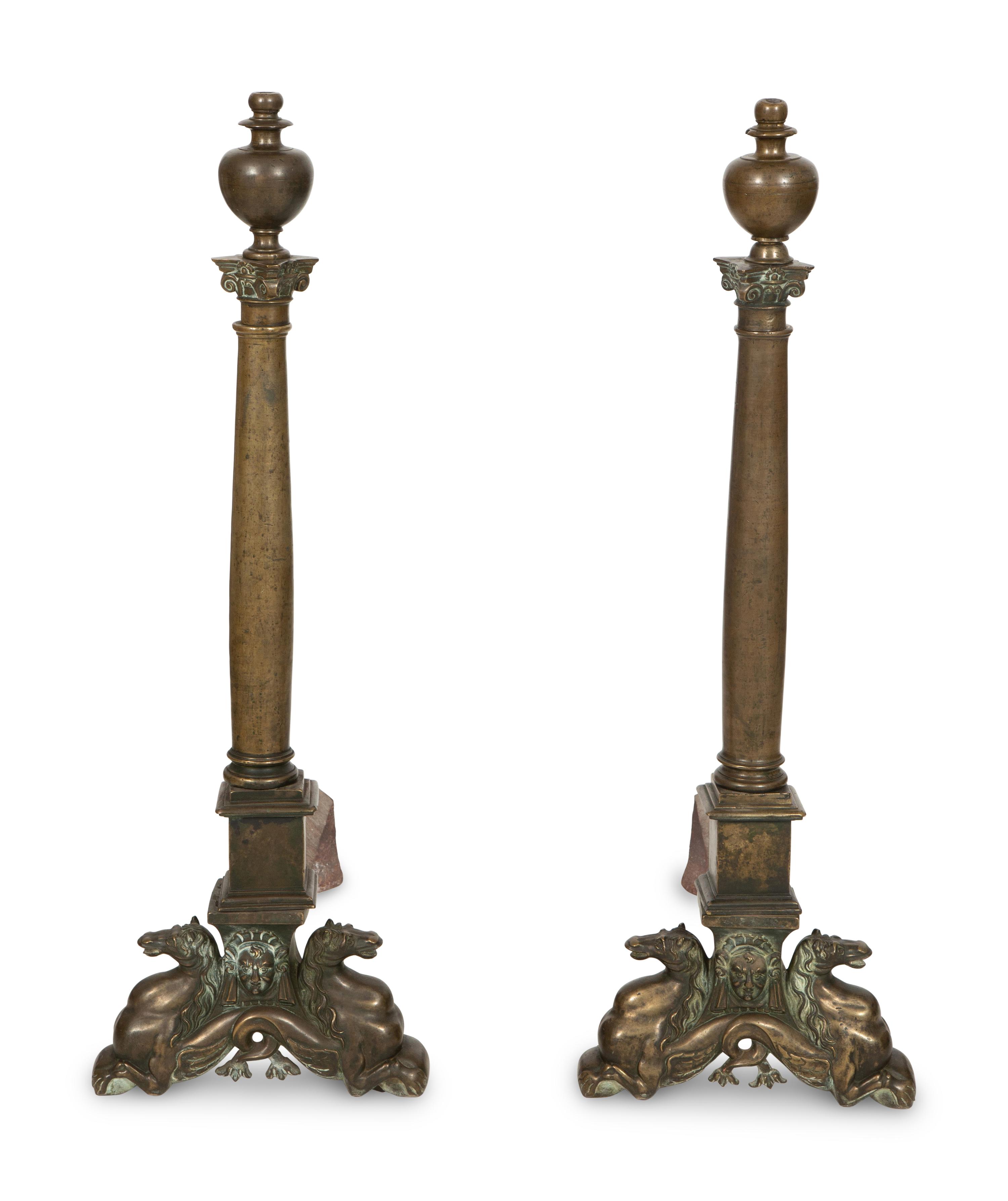 A Pair of Large Patinated Metal Andirons