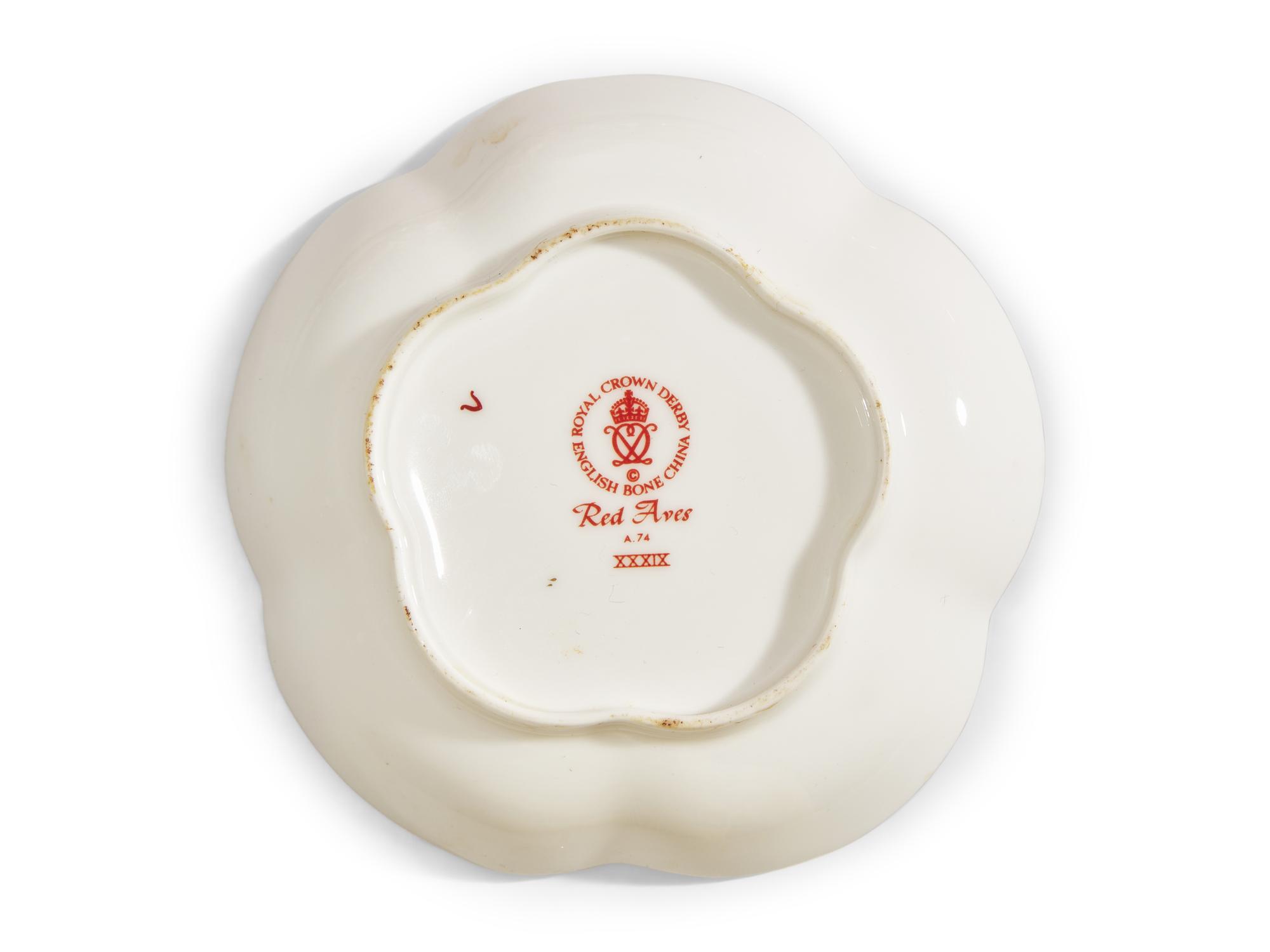A Royal Crown Derby Red Aves Porcelain Dinner Service