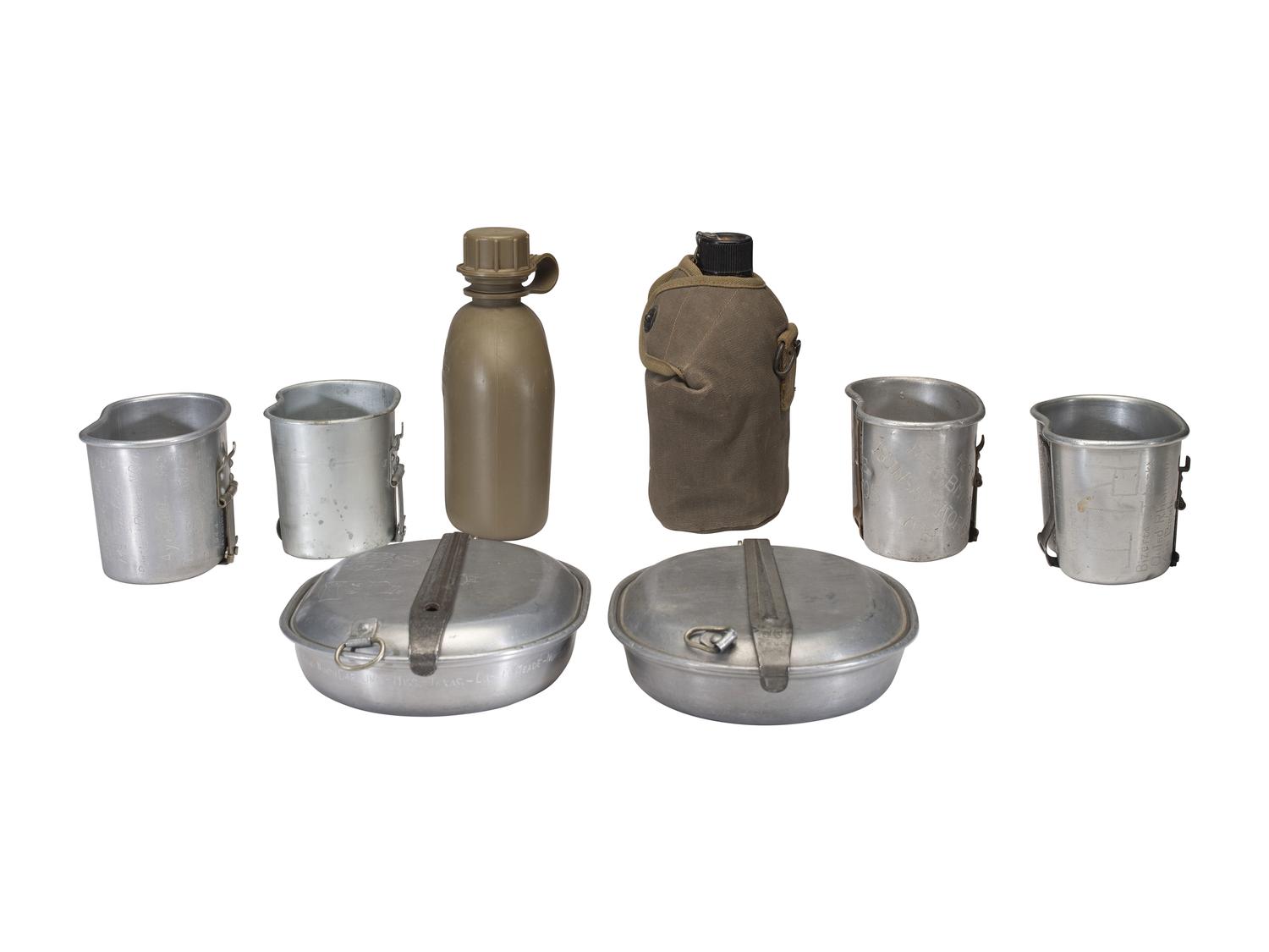 [MILITARIA]. World War II and Korean War-era canteens, canteen covers, and mess kits.