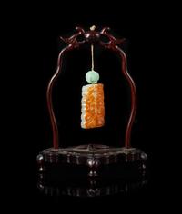 A Celadon and Russet Jade Reticulated Plaque