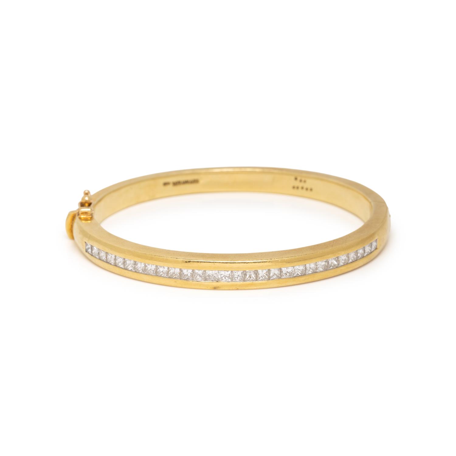 TIFFANY & CO., YELLOW GOLD AND PRINCESS CUT DIAMOND BANGLE BRACELET
