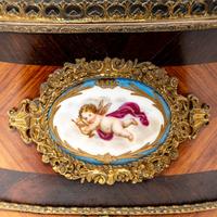 A French Porcelain and Gilt Bronze Mounted Kingwood Jardinière