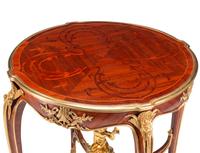 A Pair of Louis XV Style Gilt Bronze Mounted Marquetry and Mahogany Side Tables