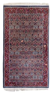 A Hereke Wool Rug 8 feet 2 inches x 5 feet.