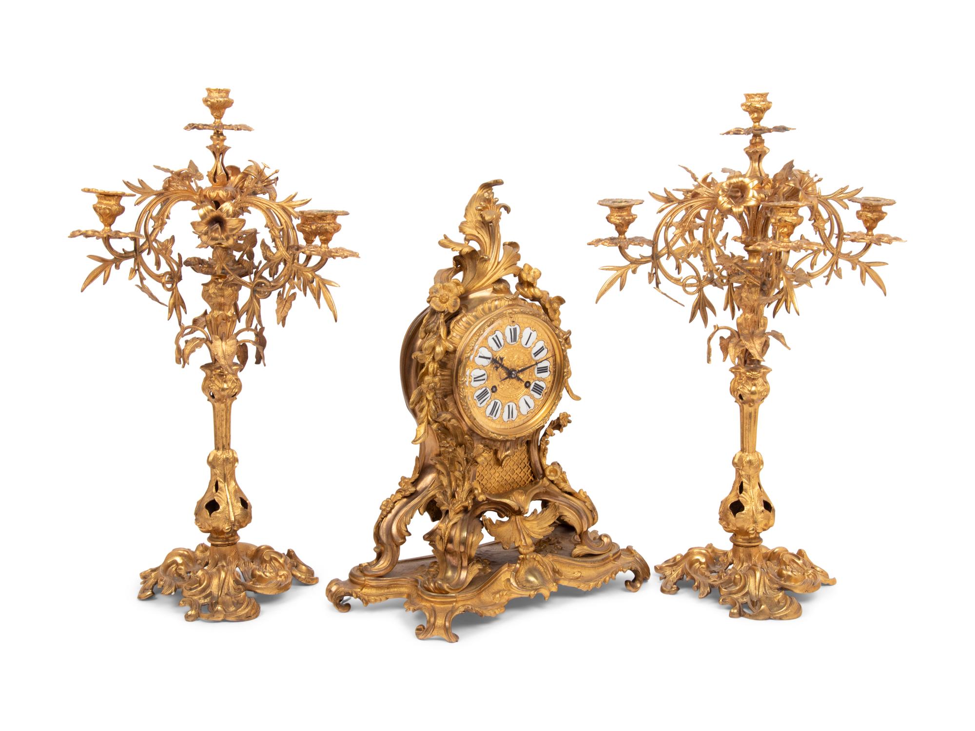 A Louis XV Style Gilt Bronze Clock Garniture
