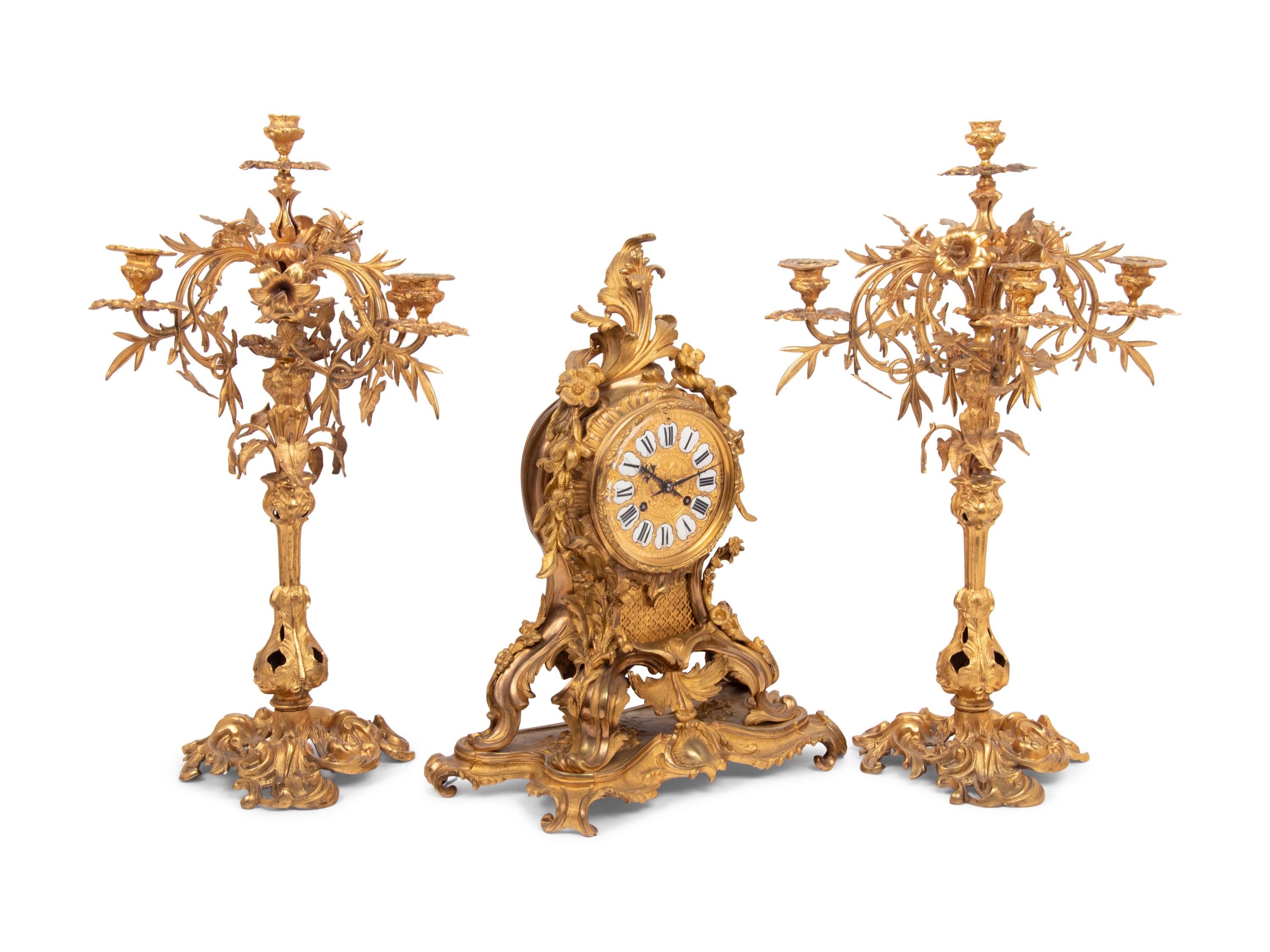 A Louis XV Style Gilt Bronze Clock Garniture