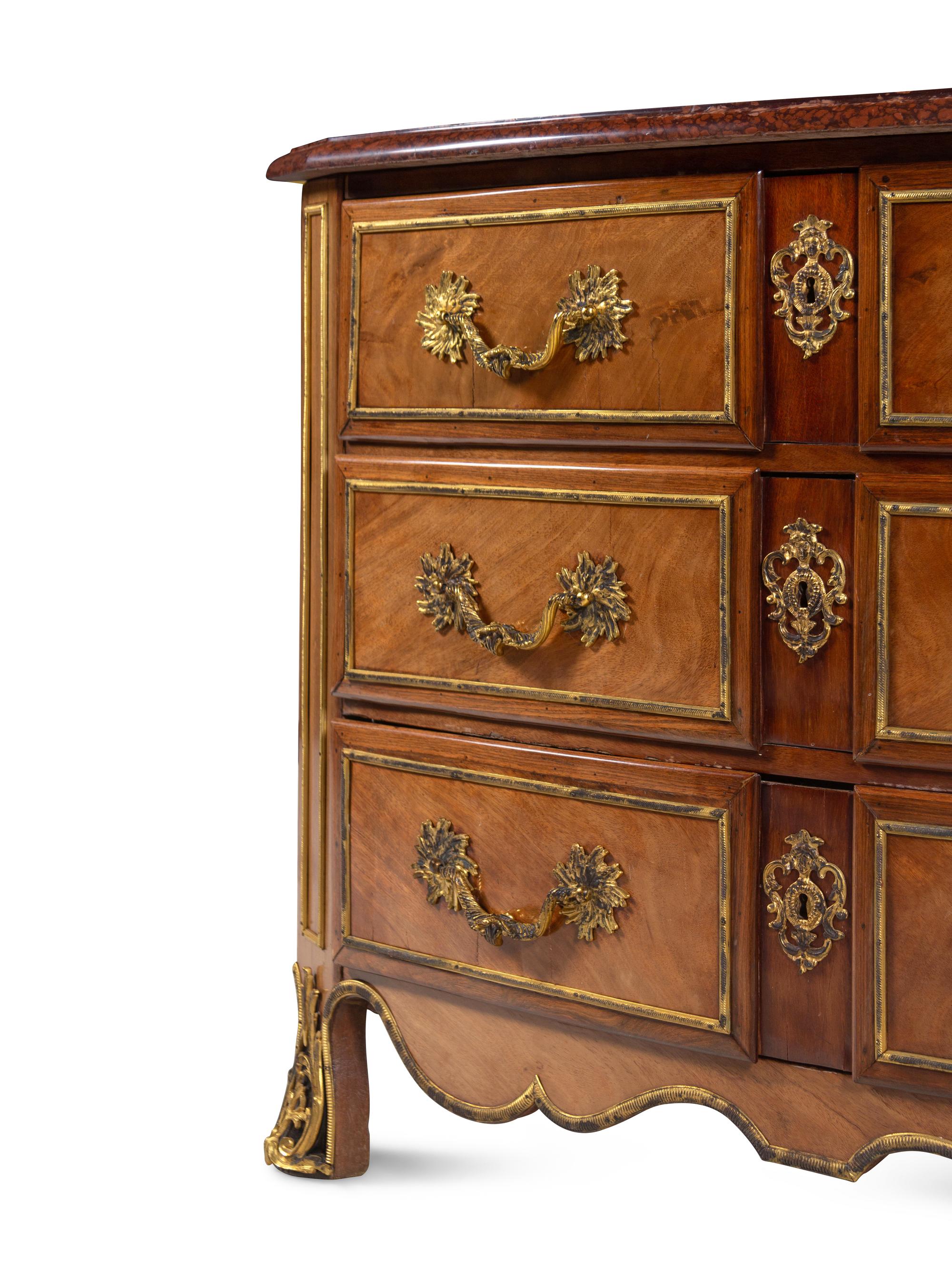 A Continental Gilt Bronze Mounted Mahogany Marble-Top Commode