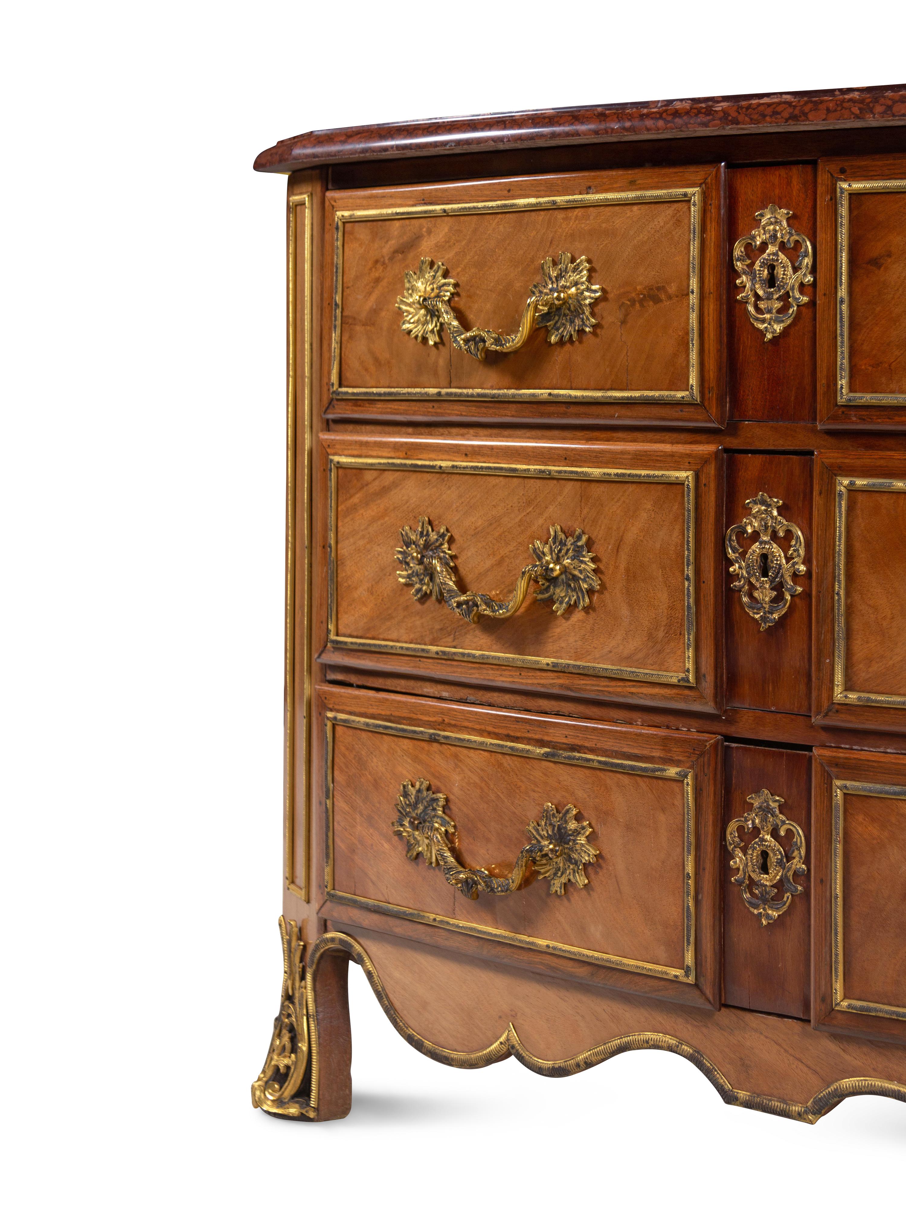 A Continental Gilt Bronze Mounted Mahogany Marble-Top Commode