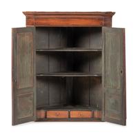 A Chippendale Figured and Paneled Mahogany Hanging Corner Cabinet