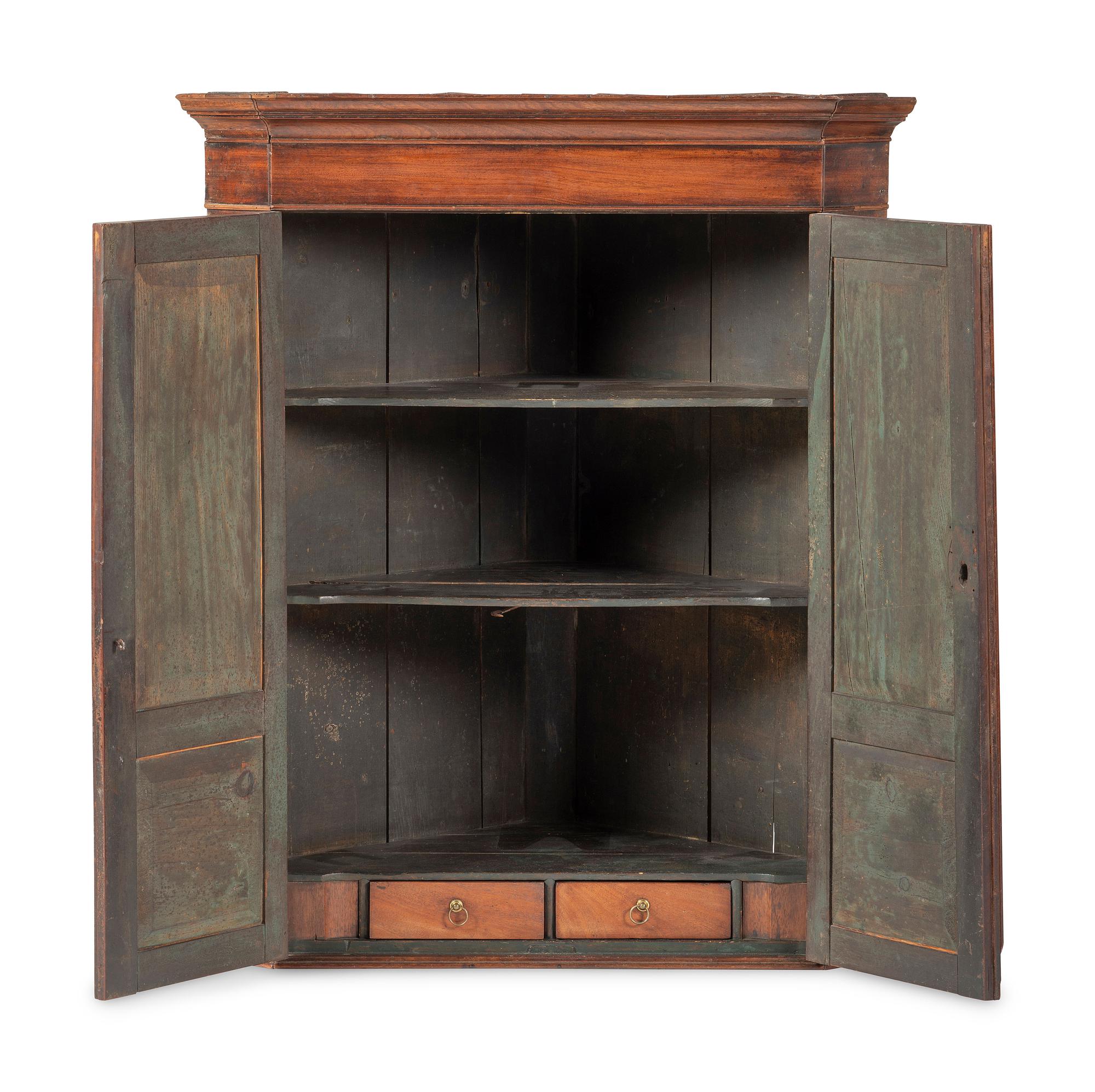 A Chippendale Figured and Paneled Mahogany Hanging Corner Cabinet